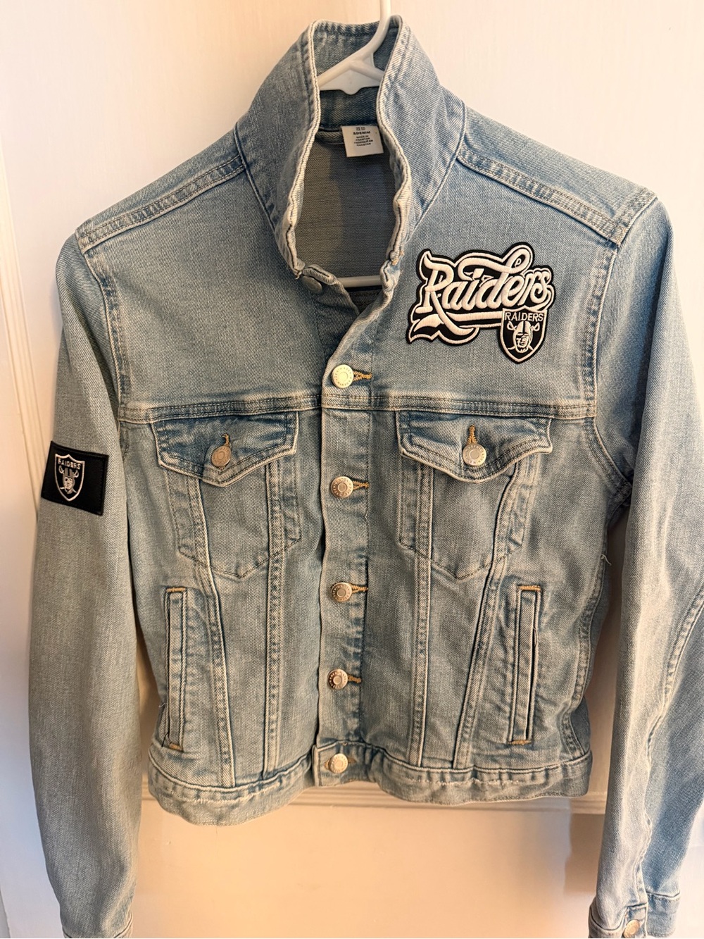 Light Wash Denim Jean Jacket with Raiders Patches